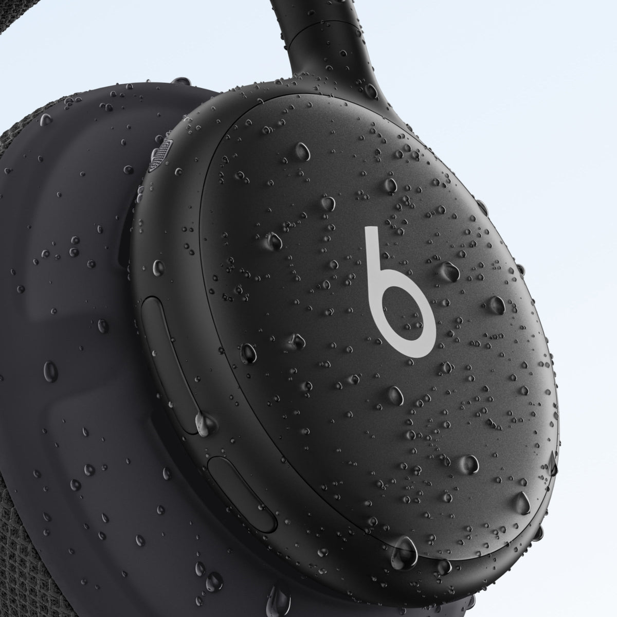 Beats 360 in Black with water droplets on the earcup