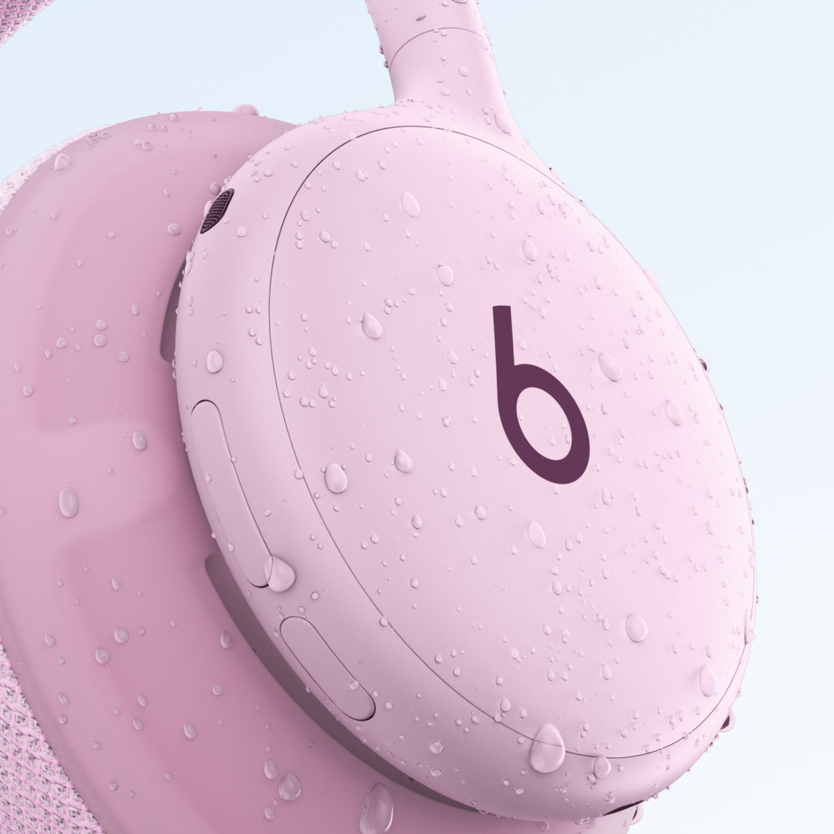 Beats 360 in Pink with water droplets on the earcup