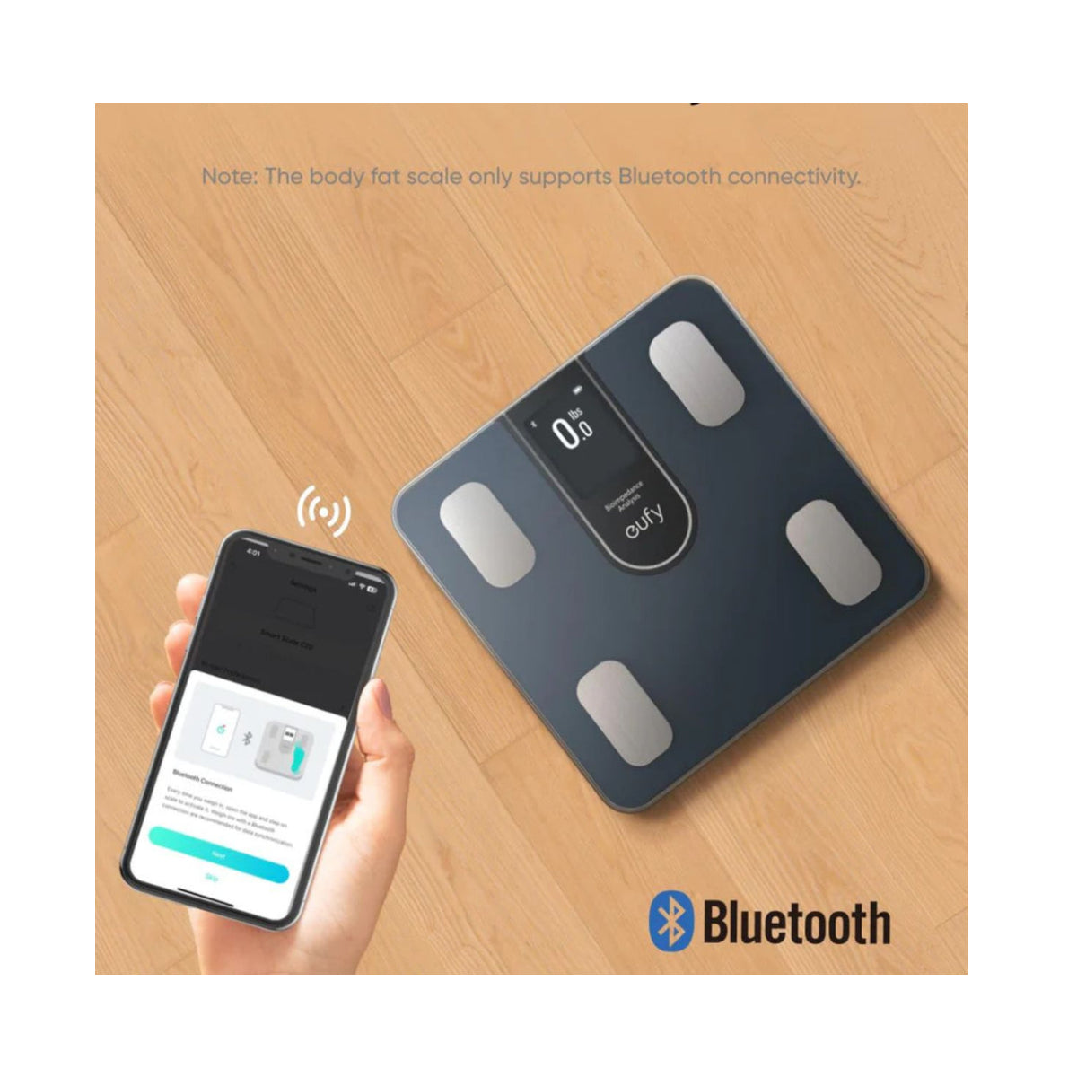 eufy Smart Scale C20 on a wooden floor sending body data to a phone over Bluetooth