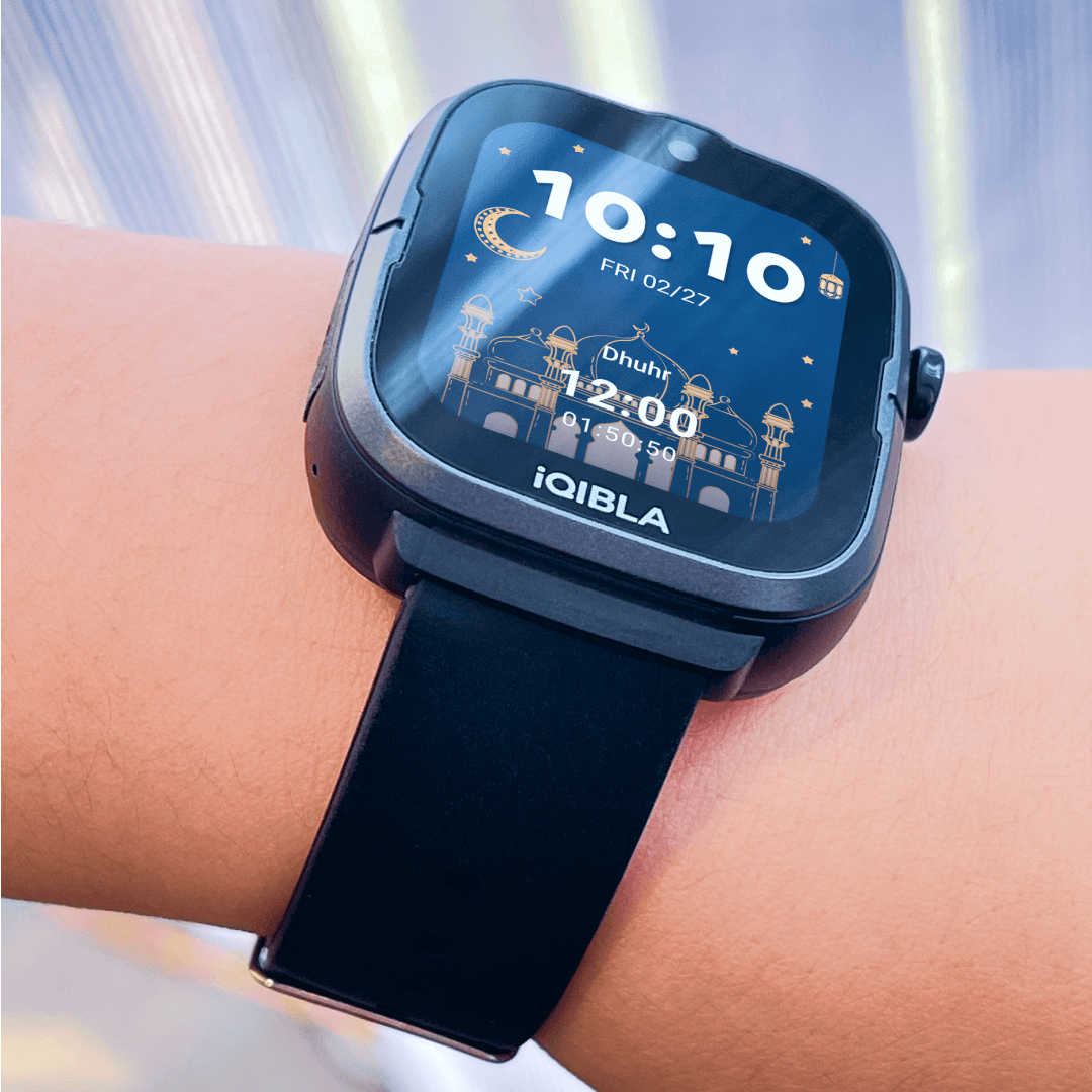 Black iQibla Qwatch A2 on a wrist showing the Dhuhr prayer time
