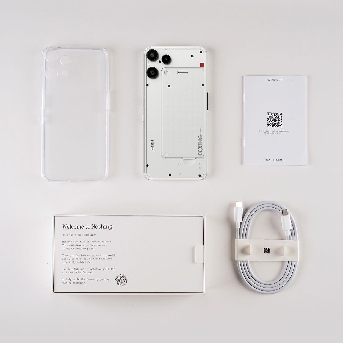 Nothing Phone (3a) Lite box contents: phone, clear case, USB-C cable, SIM tool and documents