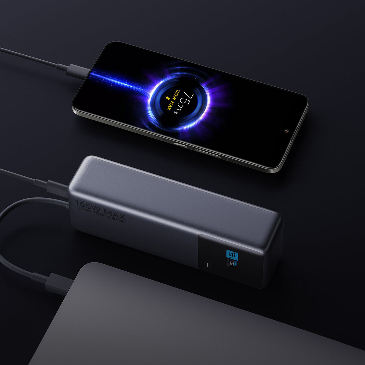 Xiaomi 165W Power Bank 10000 charging a phone and a laptop