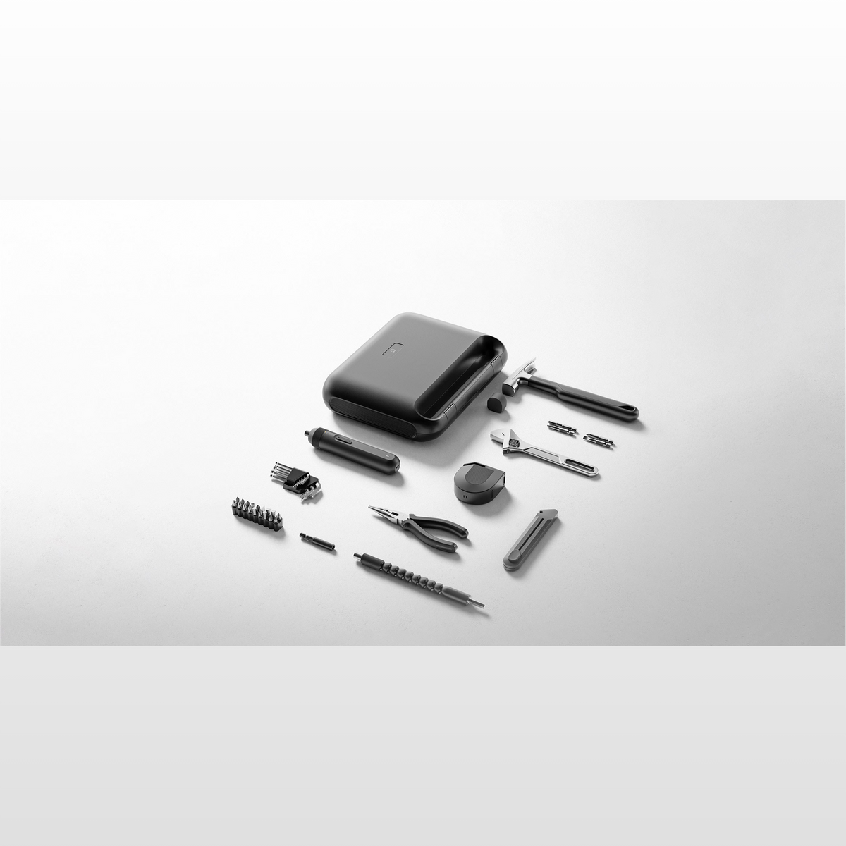 Xiaomi Mijia Tool Kit, the closed storage case with the electric screwdriver, bits, hammer, wrench, pliers and tape measure laid out beside it