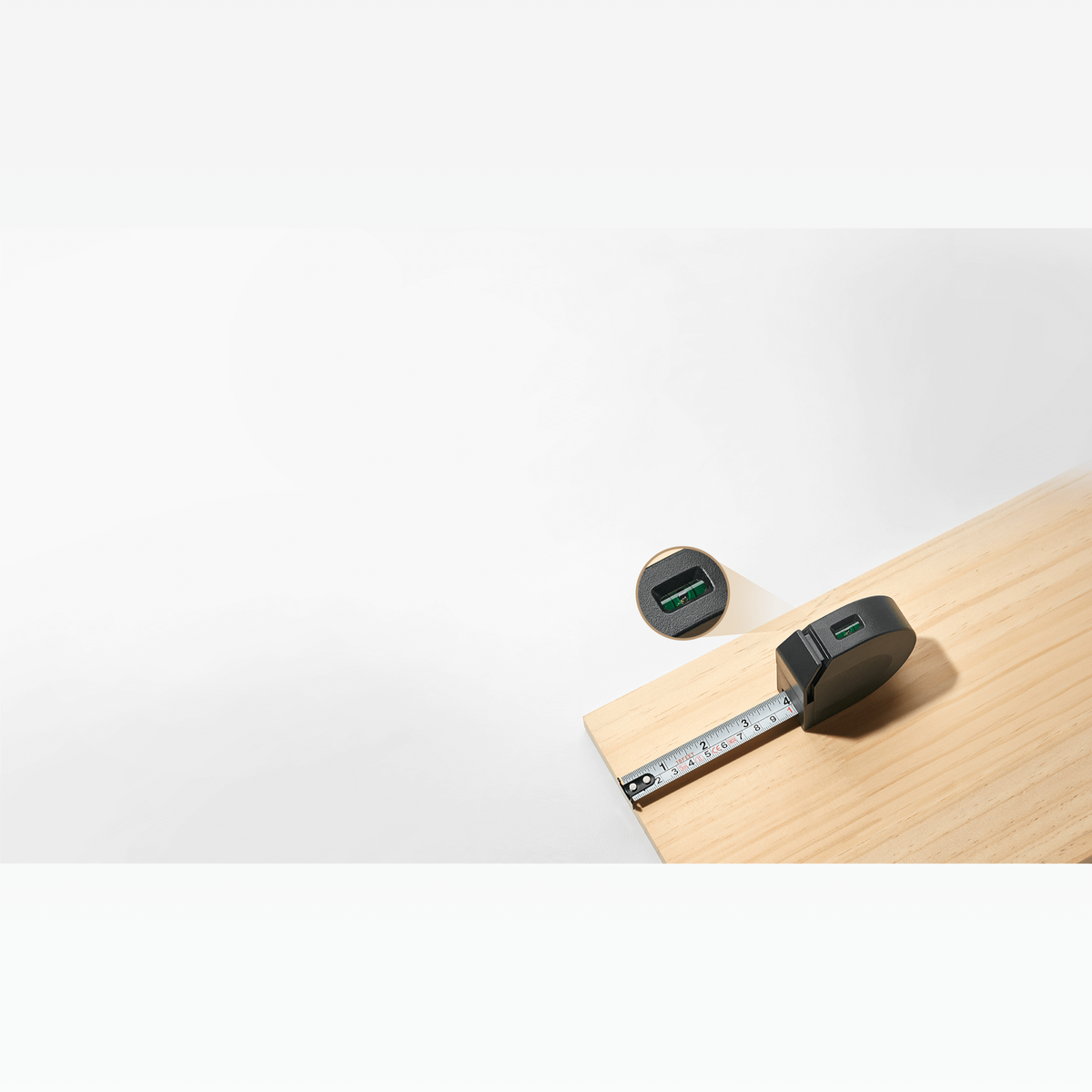 Self-locking 3 metre tape measure from the Xiaomi Mijia Tool Kit extended across a wooden surface